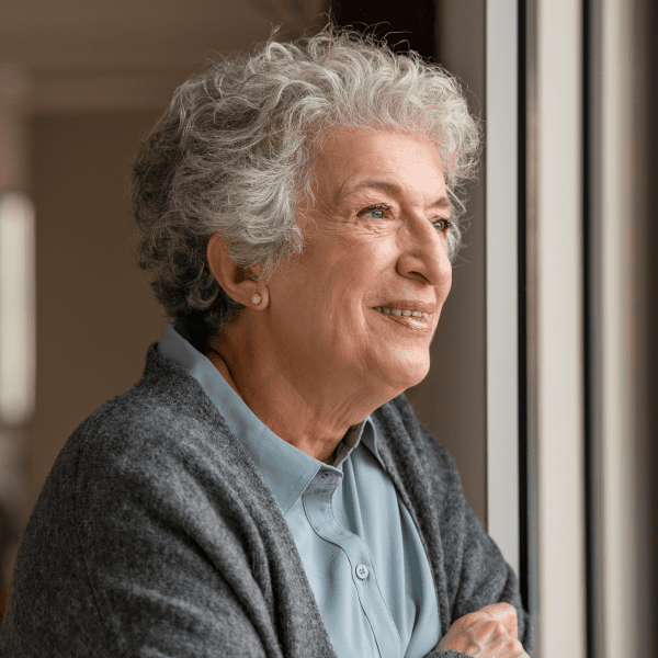 woman look out window with hope. Questions about Hope in God