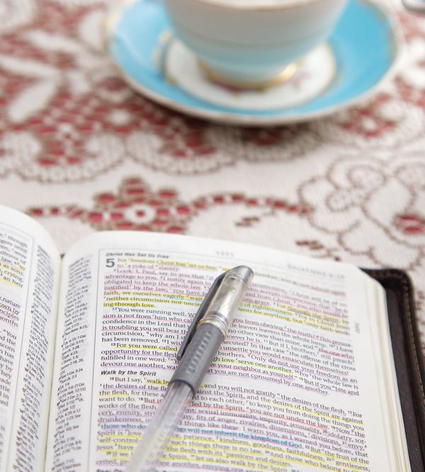 Bible pen and coffee cup. Fifth Step of Submitting to God: Applying God's Will