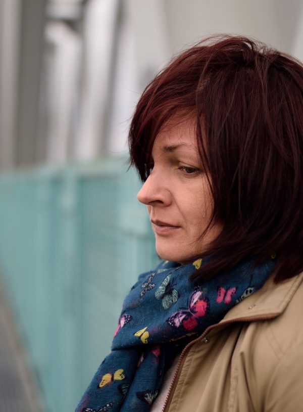 woman in coat outside feeling fear. Another Benefit of Faith in God is Overcoming Fear